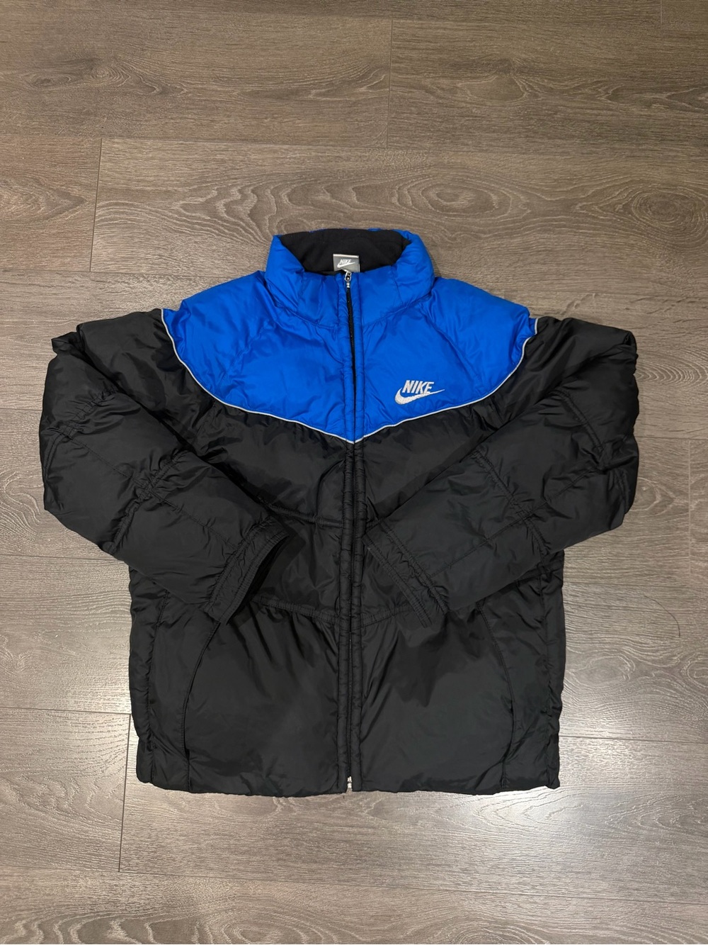Vintage Men’s Nike Black and Blue Puffer Jacket with Logo